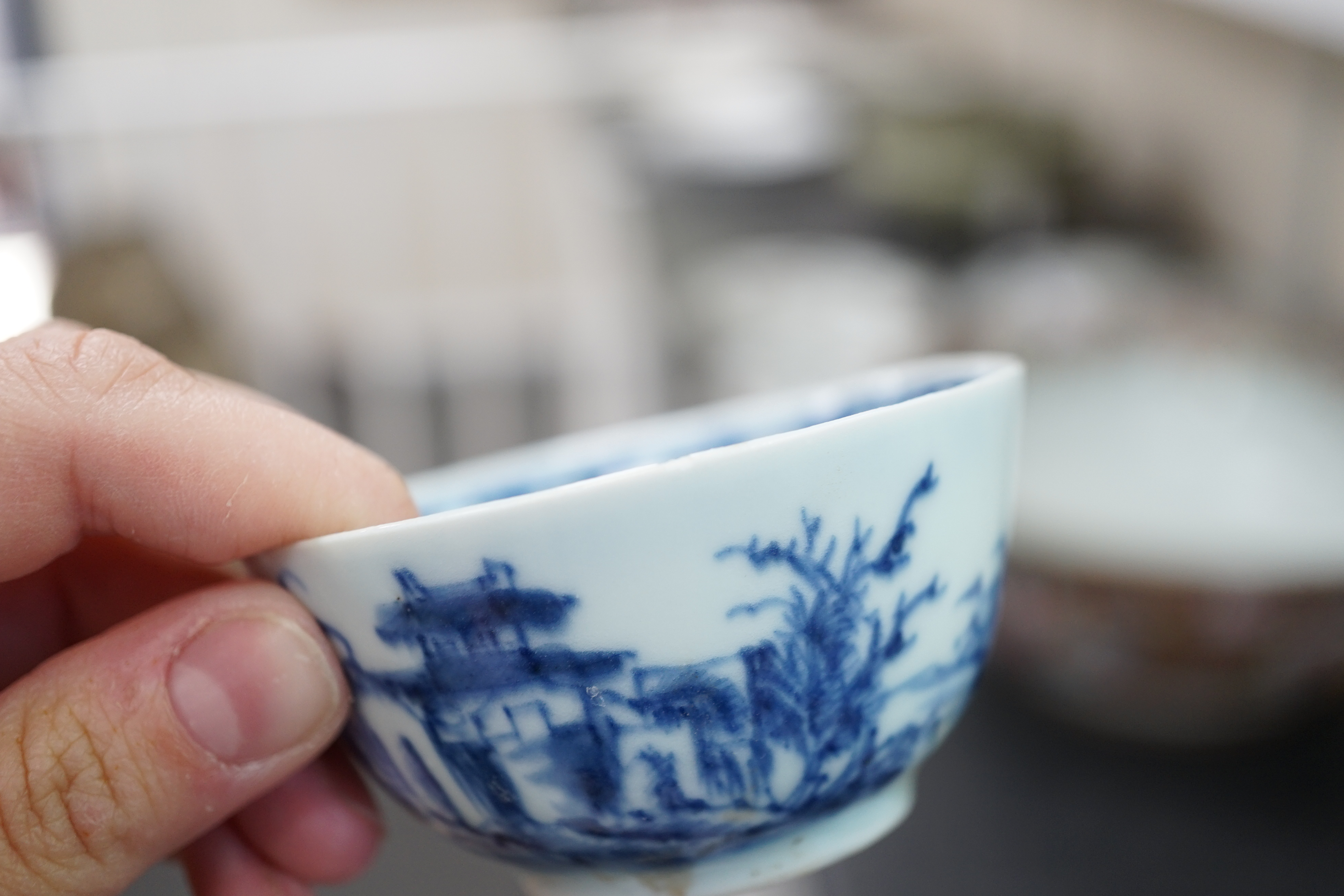 A set of twenty four Chinese Nanking Cargo blue and white ‘large pagoda’ tea bowls and saucers, Qianlong period